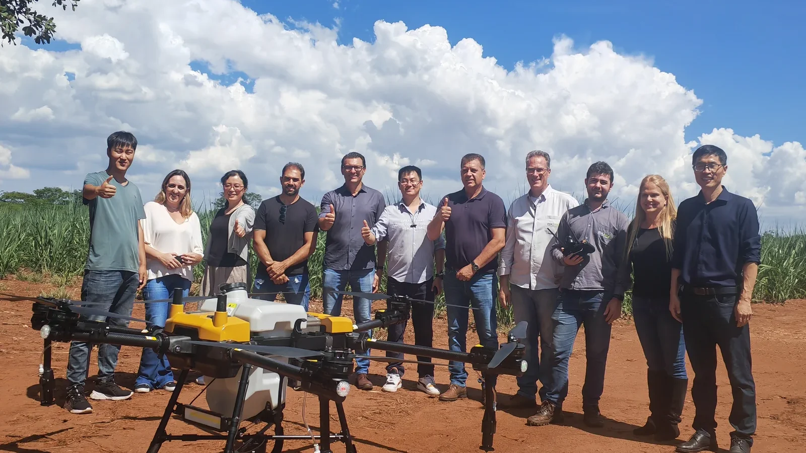 The Jitian Intelligent field team with the JT-80 spray drone during a working field trial