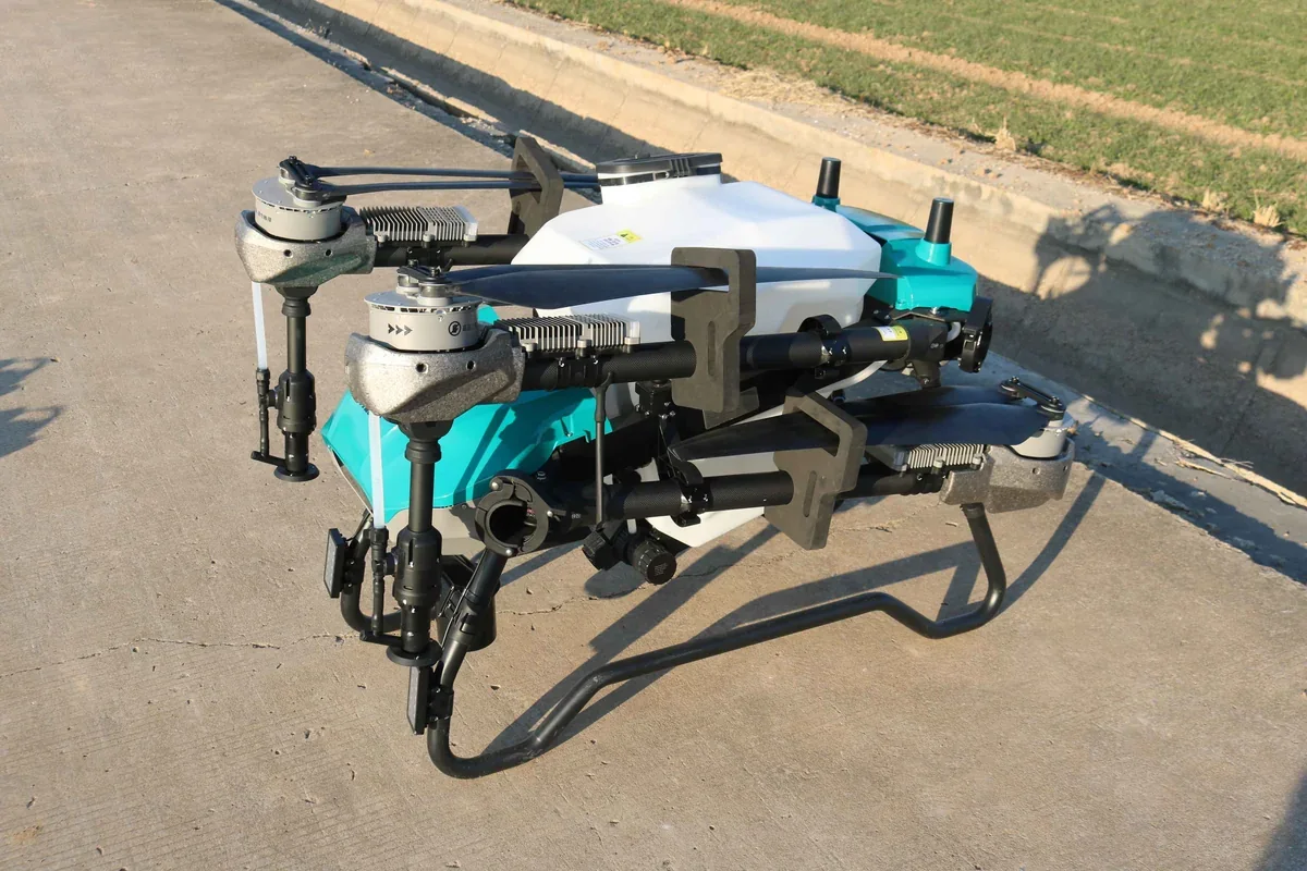 JT-80 agricultural spray drone working low over a crop field